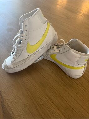 Nike White High-Top Sneakers with Yellow Swoosh